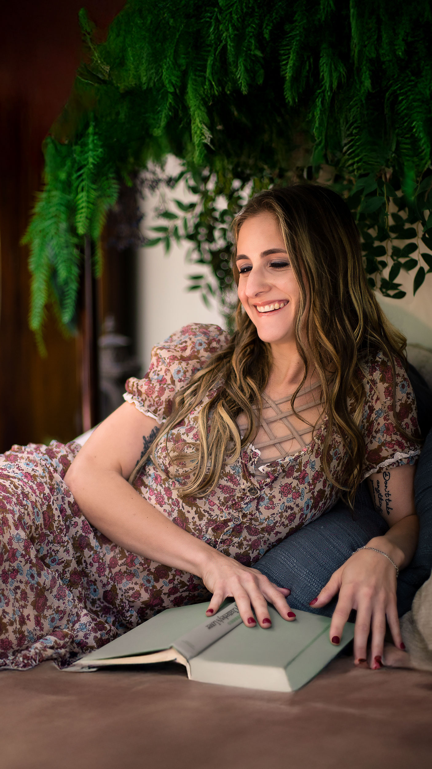 Relaxed boudoir portrait with book
